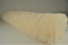 Langharig bont Champagne