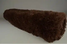 Langharig bont Bruin